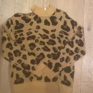 Sweater with open shoulder. Size L. New w/o tags.